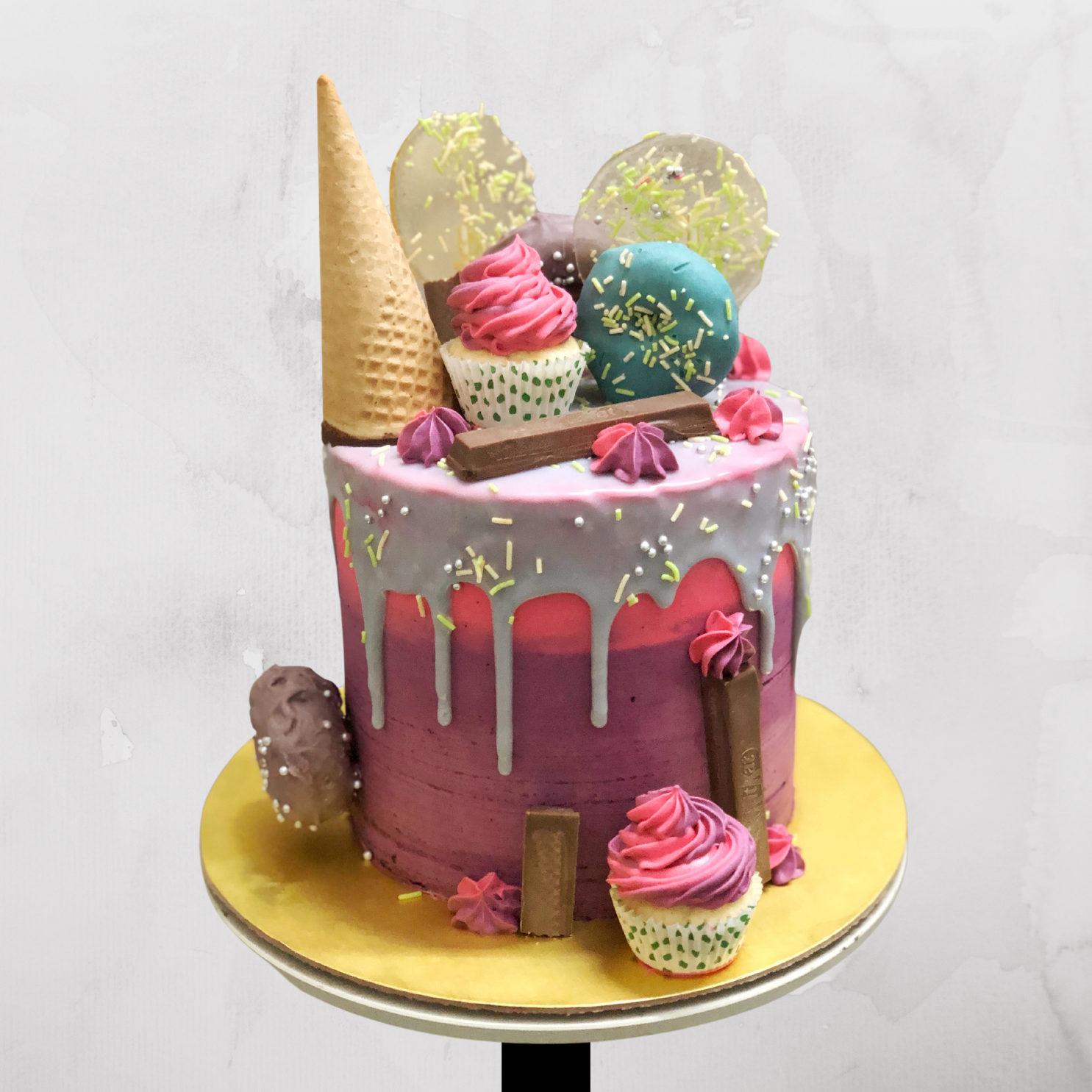 Candy Wonderland Drip Cake with Cupcakes & Cones